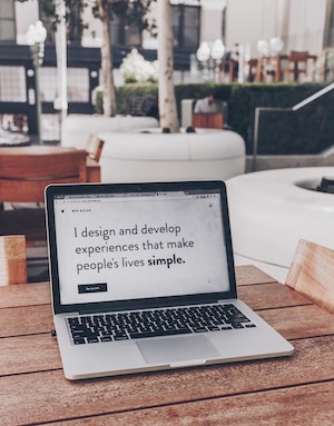 open laptop on wooden table